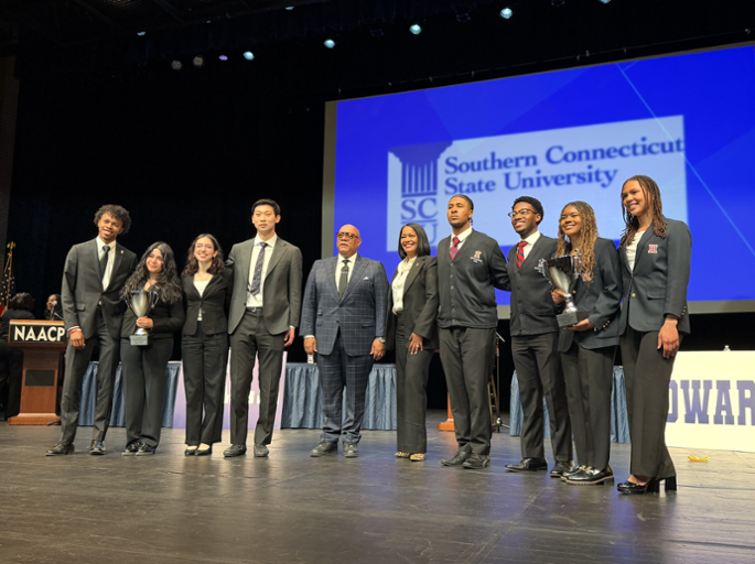 Congresswoman Hayes poses for a photo with the Yale and Howard debate teams after moderating the CT NAACP Great Debate