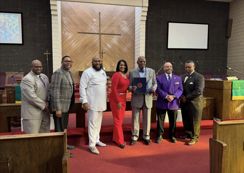 Congresswoman Hayes poses for a photo with community members at an MLK Day Worship Service